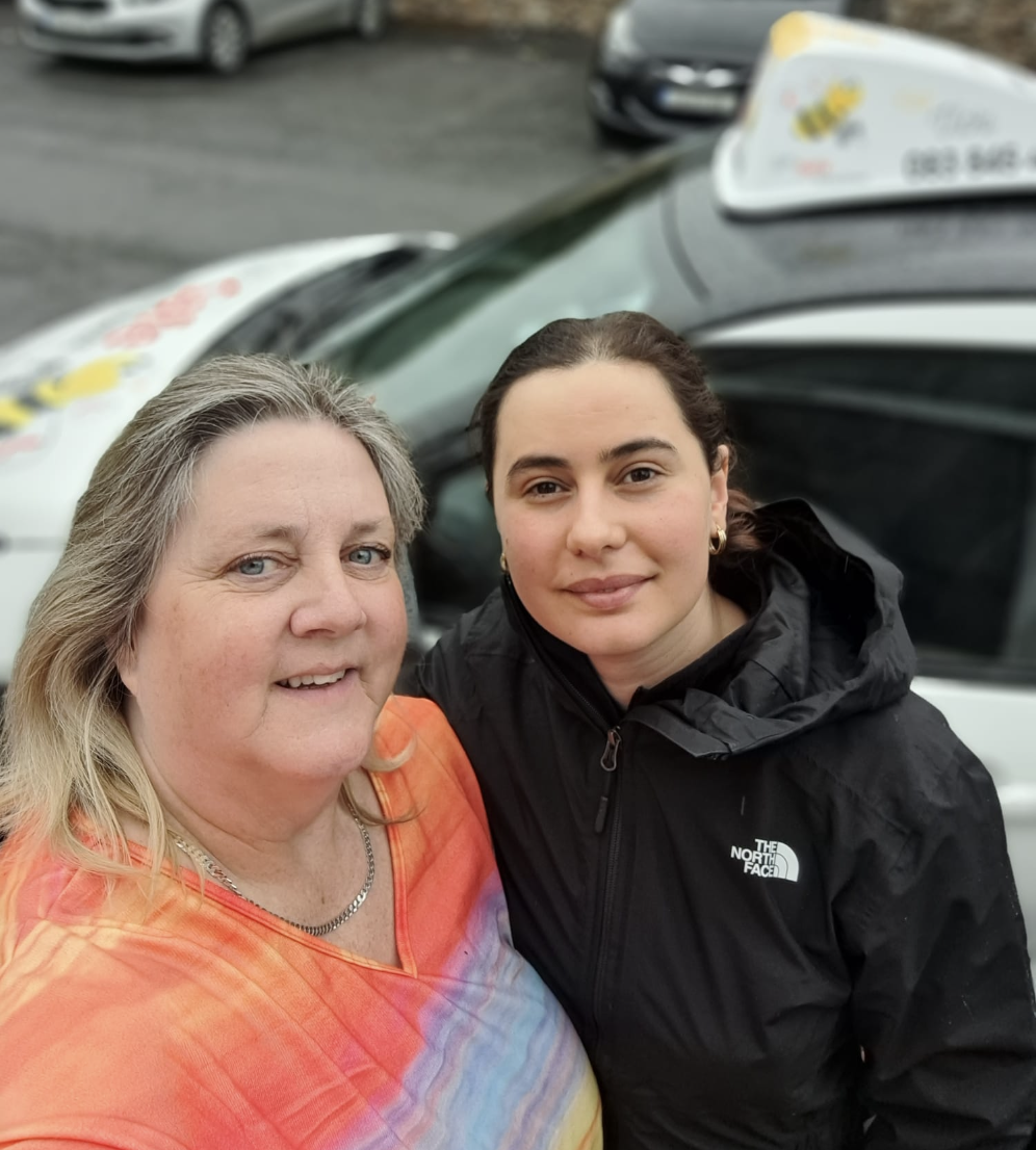 Bee Safe Driving School student and Vicki smiling after a driving test pass in Longford