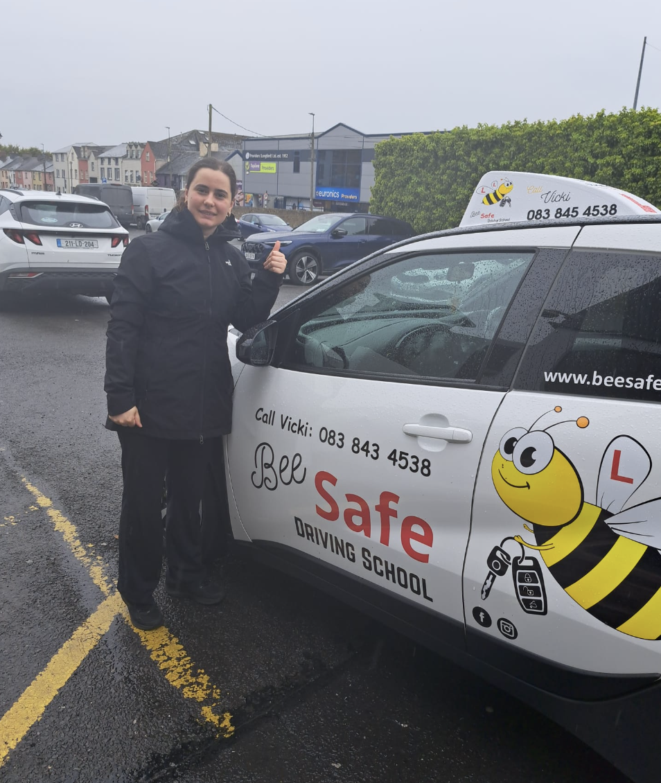 Bee Safe Driving School student beside the tuition car in Athlone after passing the driving test